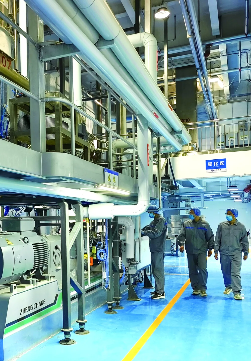Pet Secret team inspecting a pet food production line in the workshop